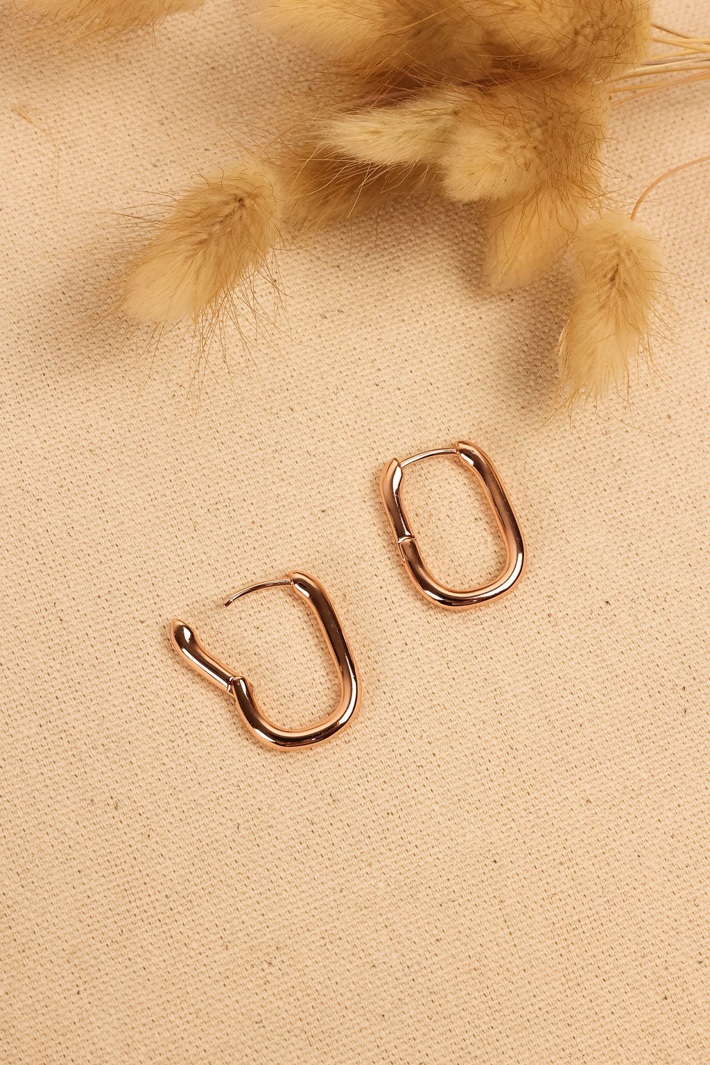 close up image of geometric hoop in rose gold.