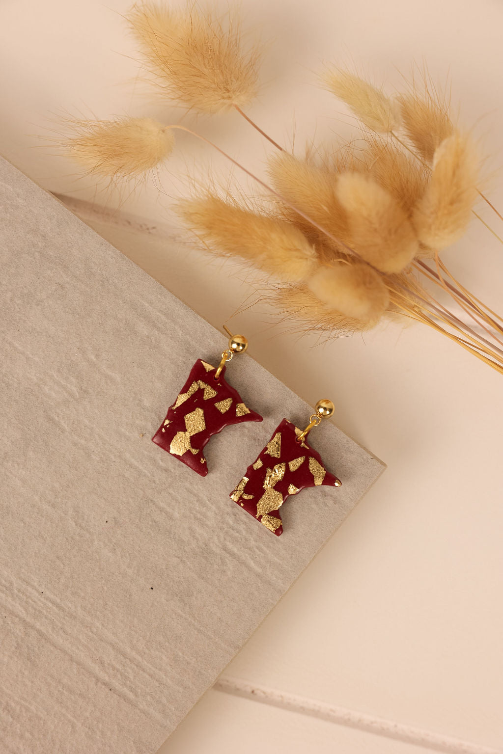 Handmade maroon and gold Minnesota earrings. Polymer clay Minnesota earringds