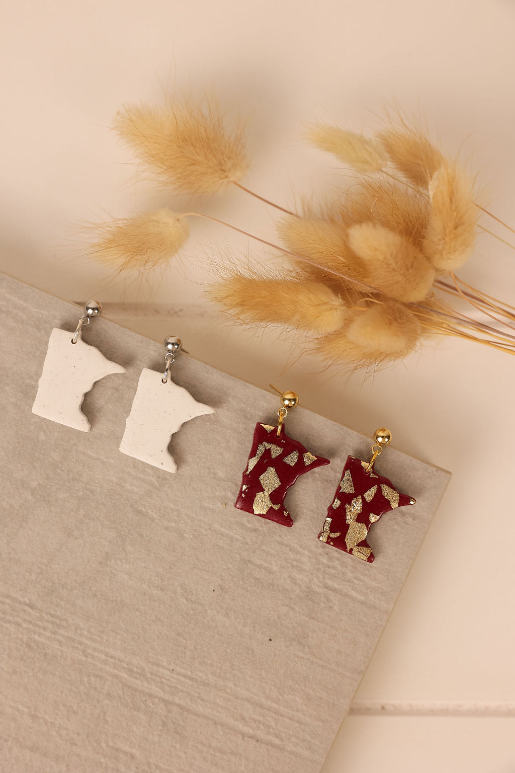 Handmade Minnesota state earrings. Handmade polymer clay Minneaota State Earrings