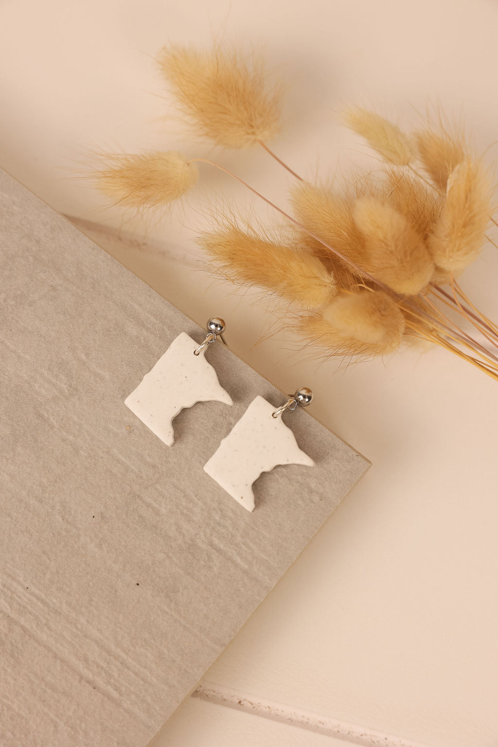 White granite Minnesota State earrings. Handmade Minnesota state earrings.