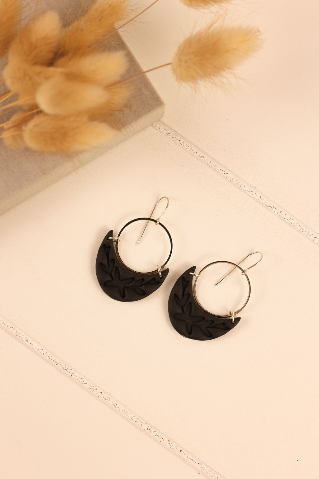 Luna earring in black with silver hardware.