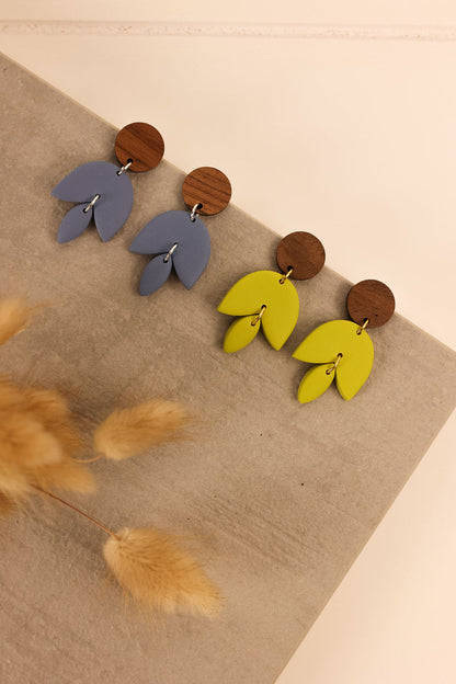 Freja earrings pictures in bluestone and citron on a neutral background. 