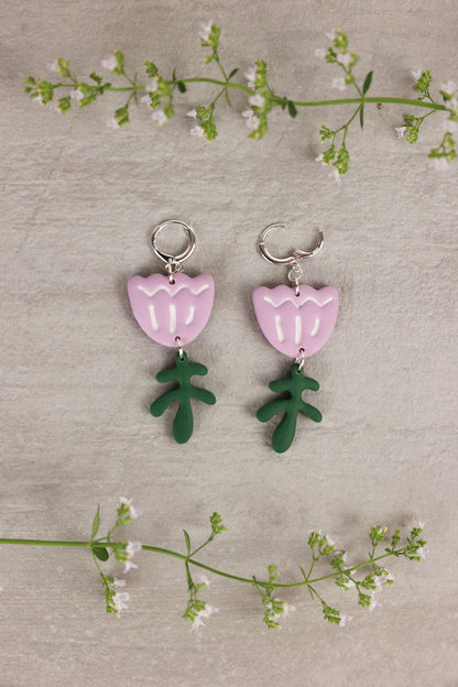 tulip shaped earring with leaf accent in light purple color. 