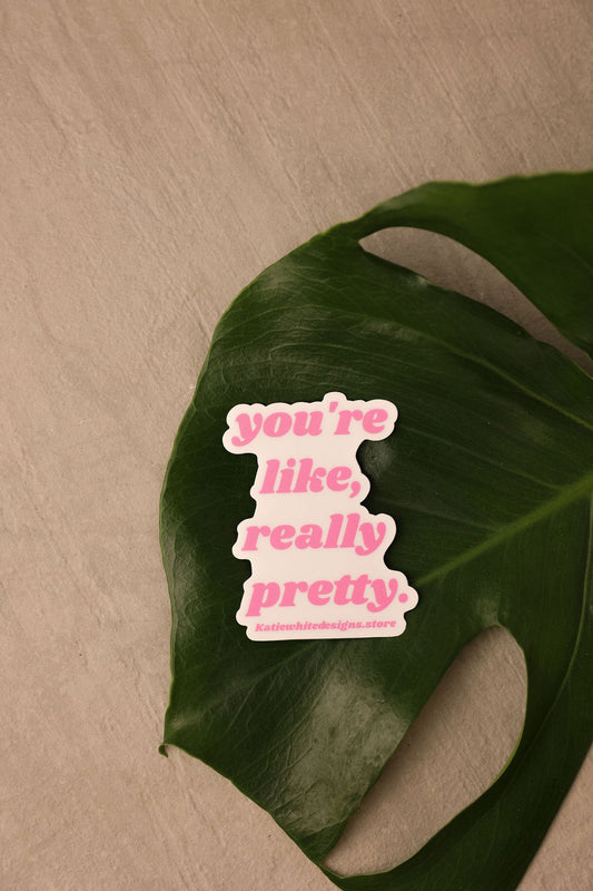 Sticker that says "You're like, really pretty." in Pink text with a light pink background. 