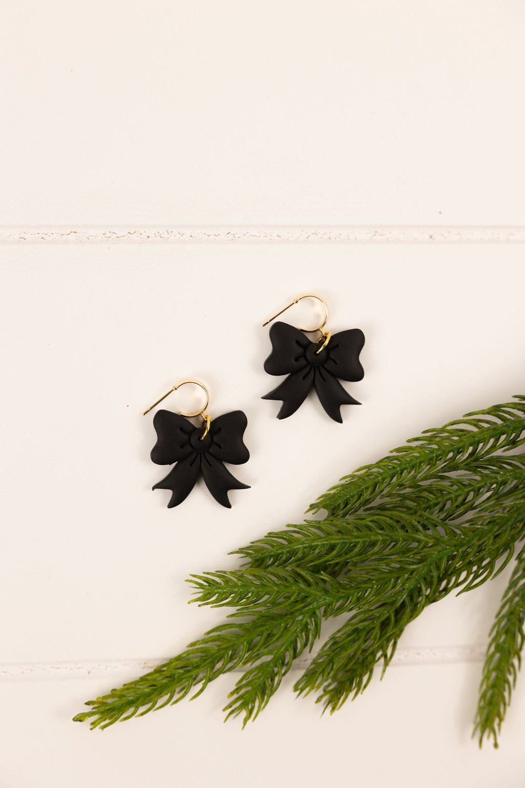 Polymer clay black bow earrings. Handmade and nickel free