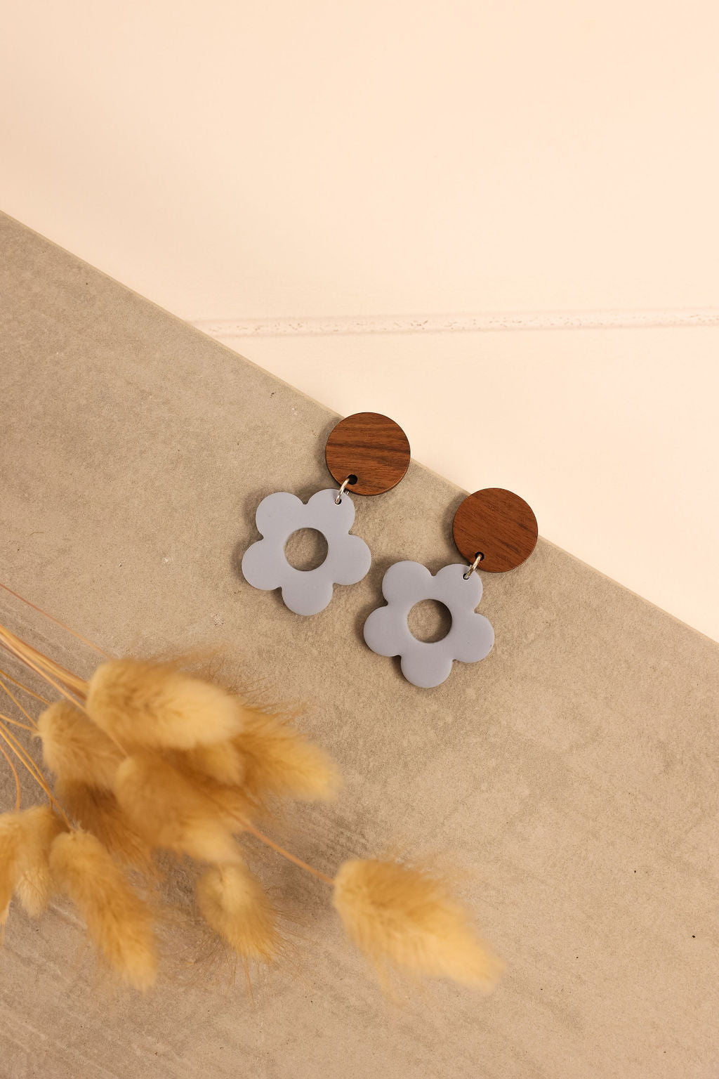 Blue polymer clay flower power earring. 