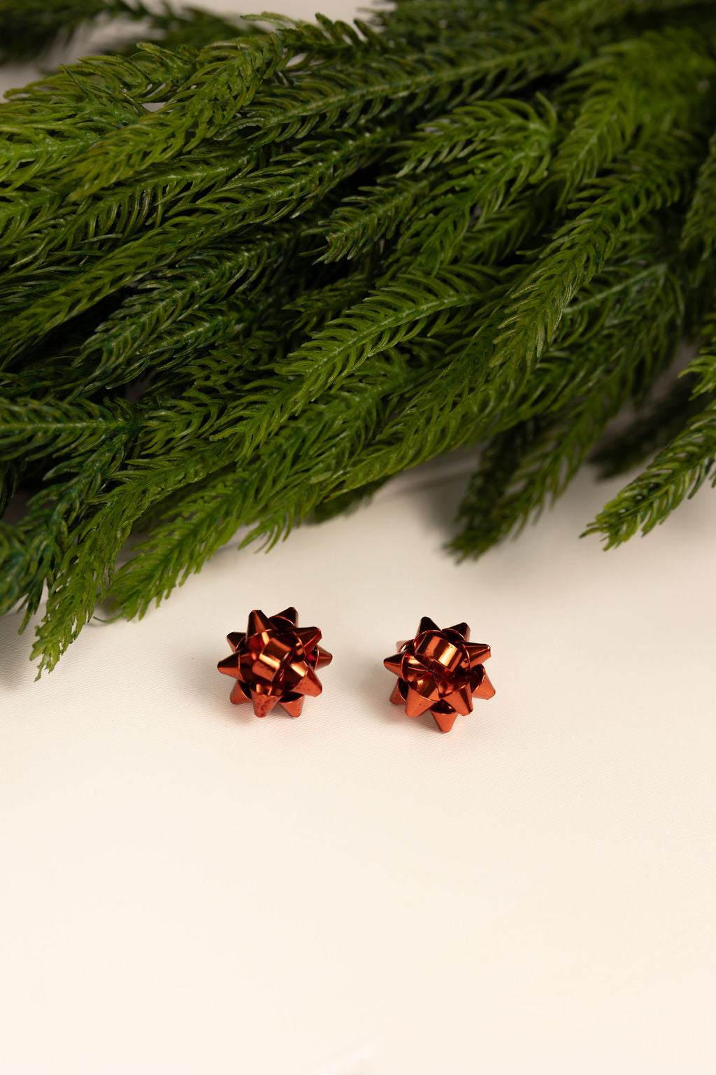 Red retro holiday ribbon studs. Lightweight and nickel free. Holiday gift